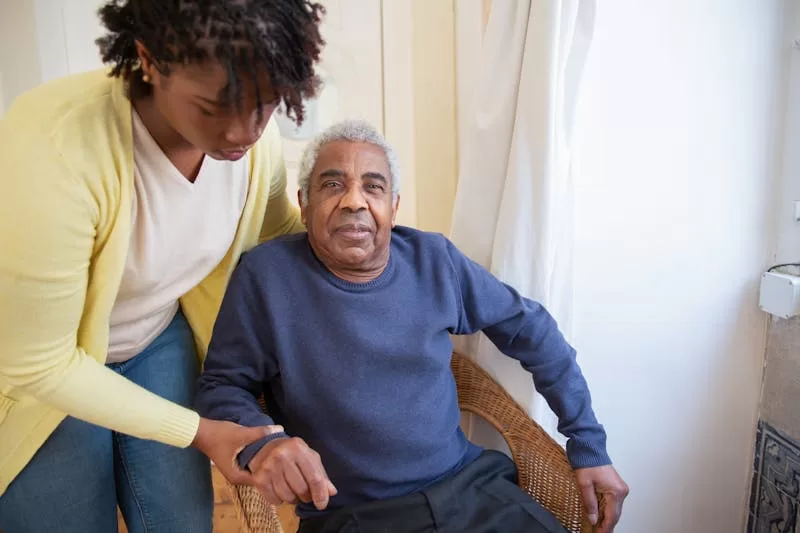 Caregiver assisting with daily personal activities
