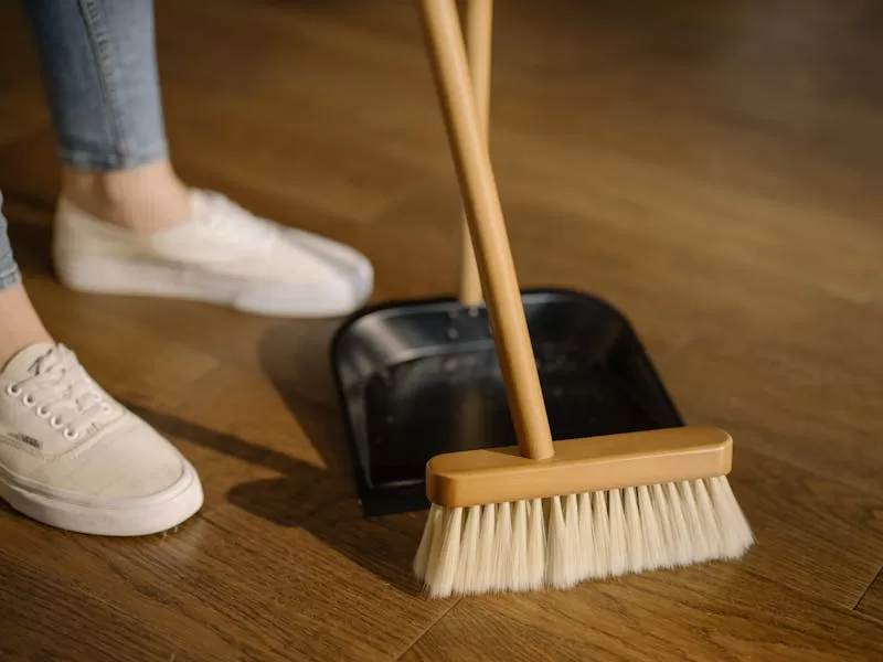 Support worker helping with household cleaning tasks